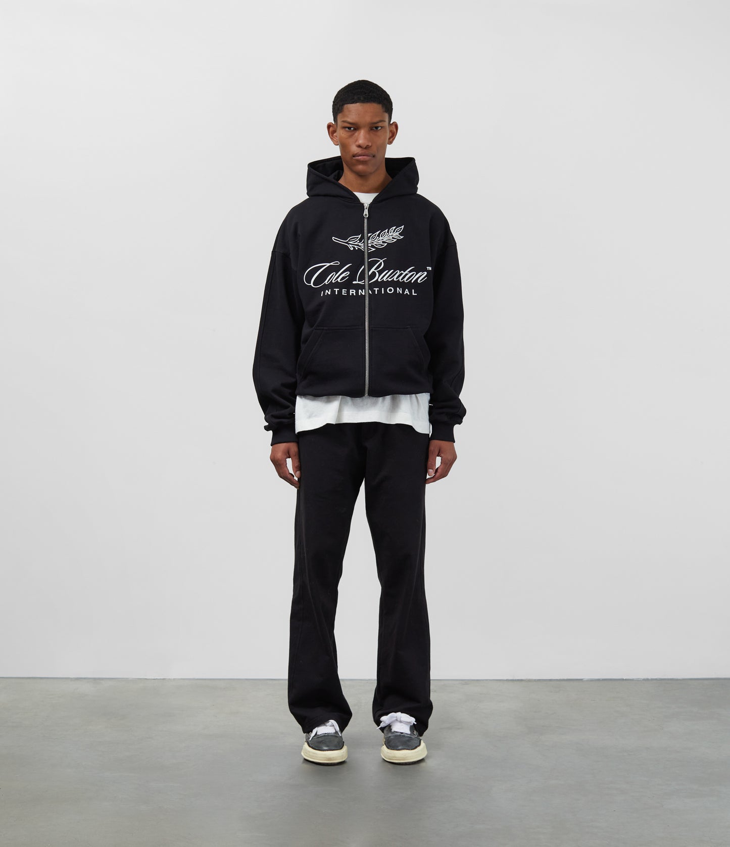INTERNATIONAL ZIPPED HOODIE
