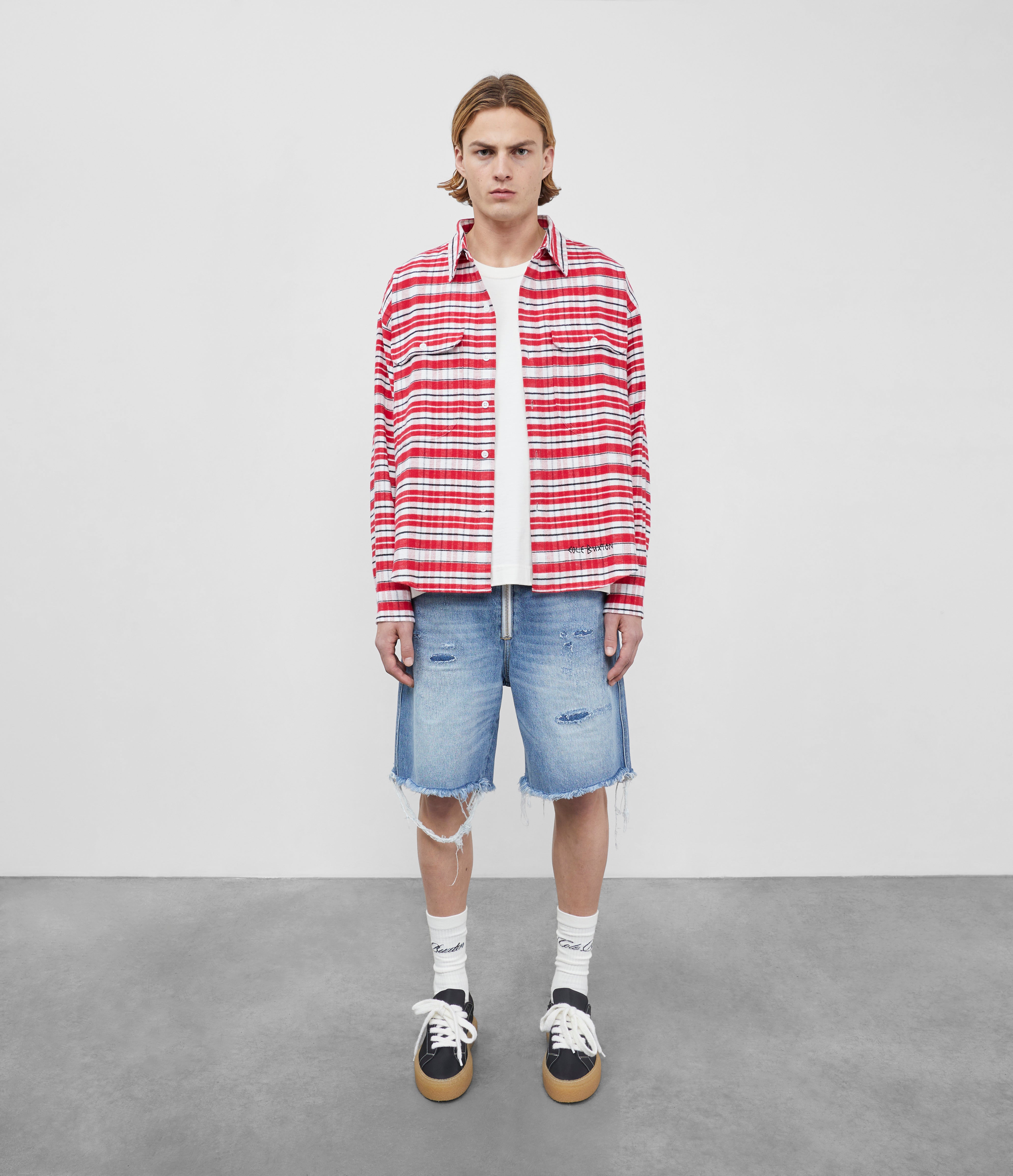 Red distressed mopping jean shorts