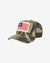 Camouflage trucker hat with American flag patch on a white background