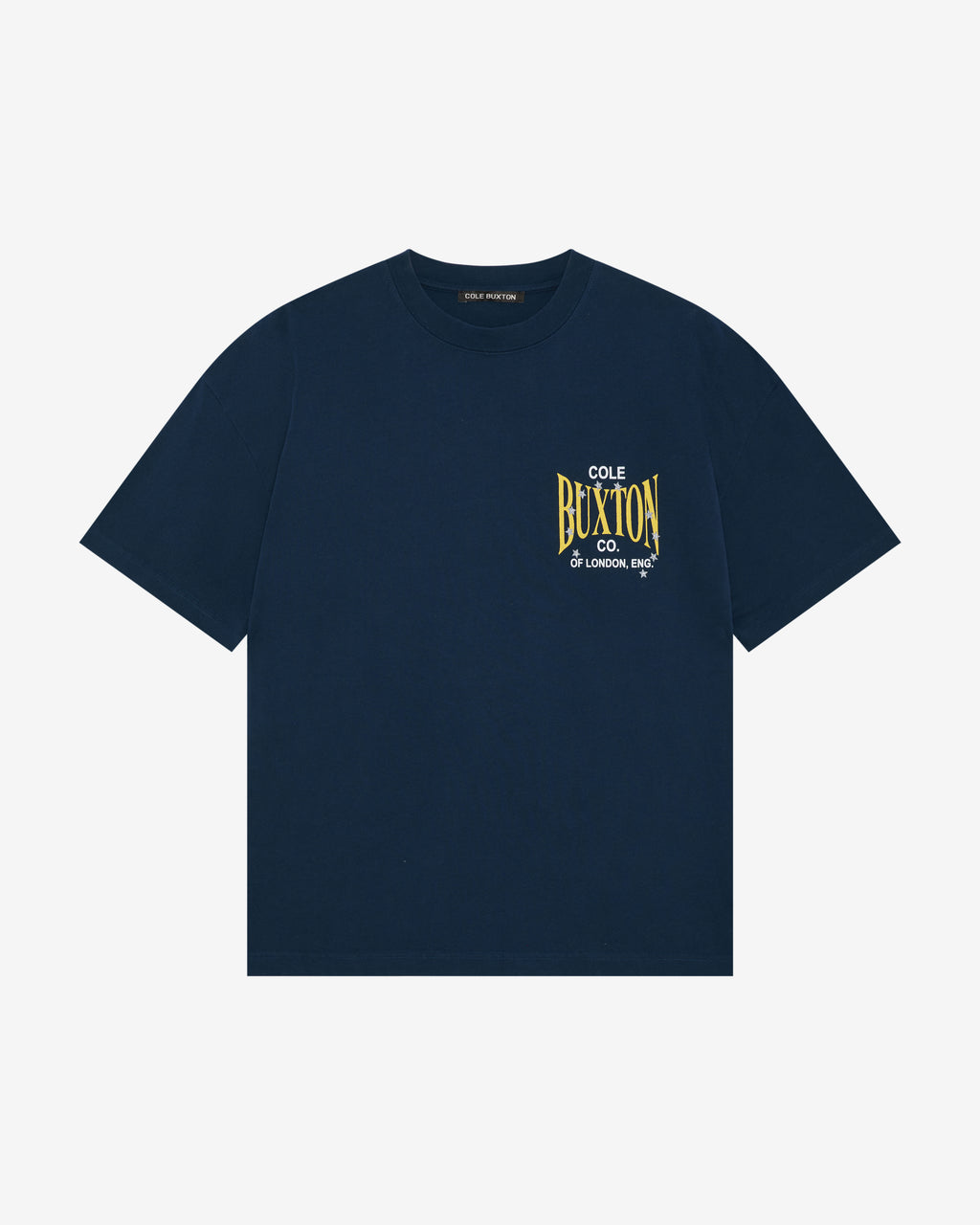 A navy blue short-sleeve crewneck t-shirt with a yellow and white graphic print on the left chest reading 'COLE OF BUXTON CO. LONDON, ENGLAND'.