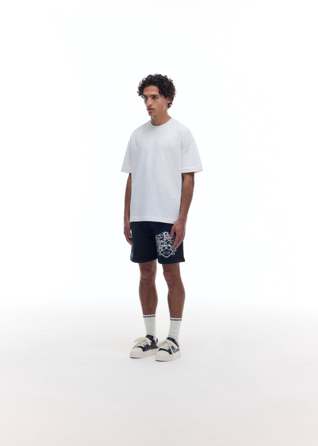 DISTRESSED COLLEGIATE CREST SHORTS