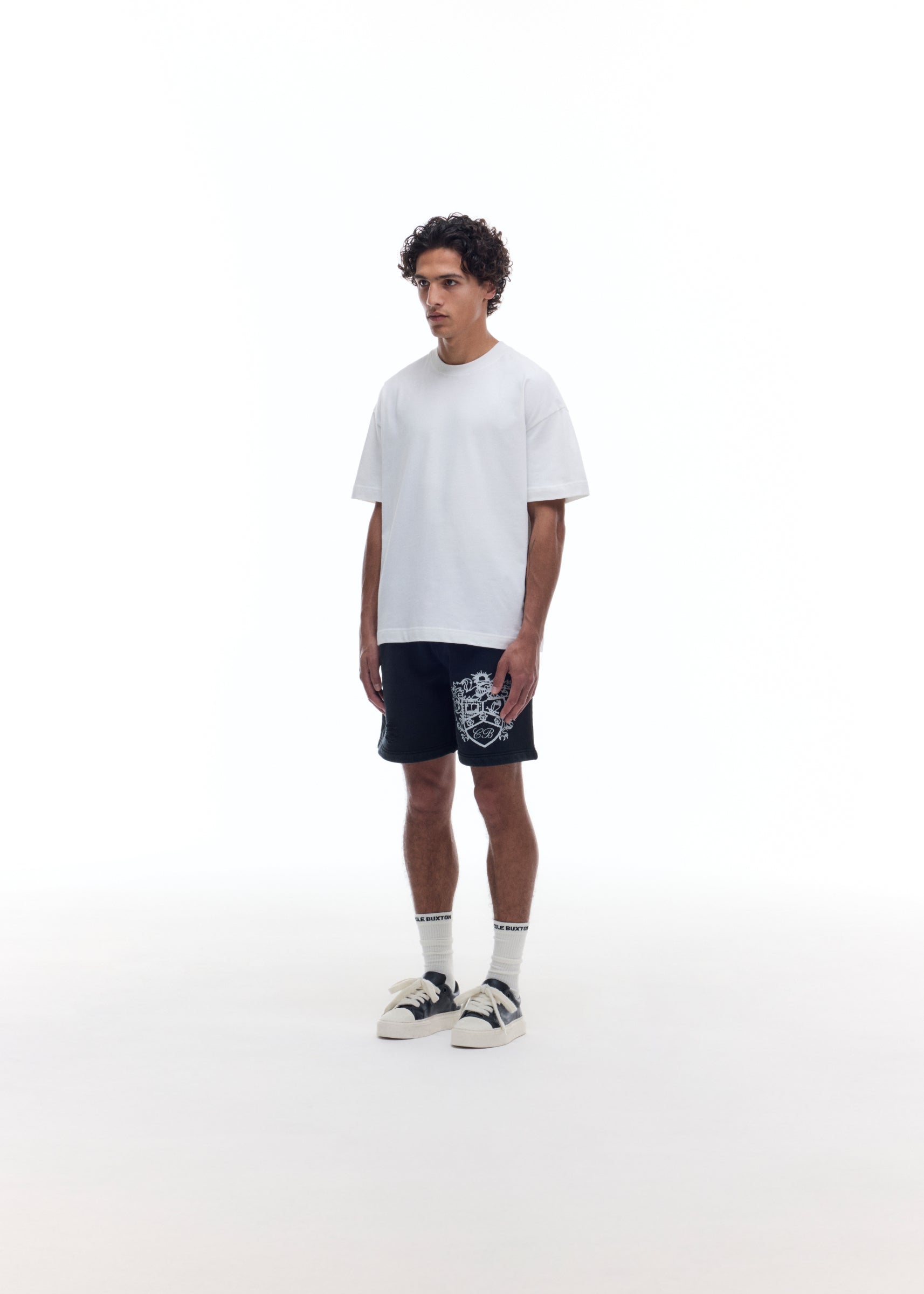 DISTRESSED COLLEGIATE CREST SHORTS