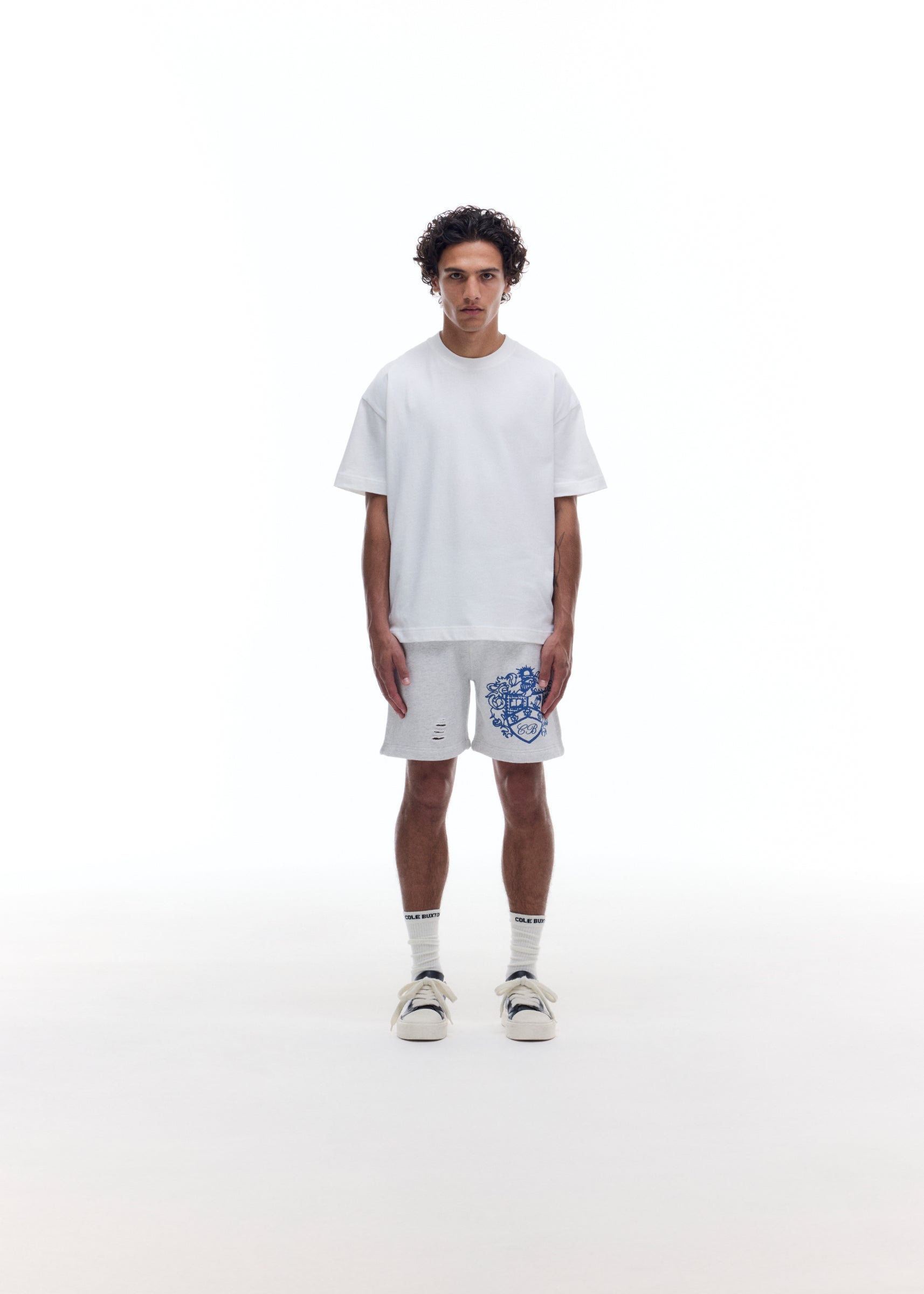DISTRESSED COLLEGIATE CREST SHORTS