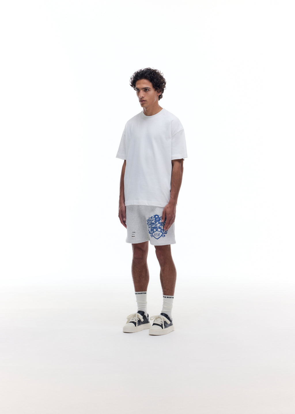 DISTRESSED COLLEGIATE CREST SHORTS