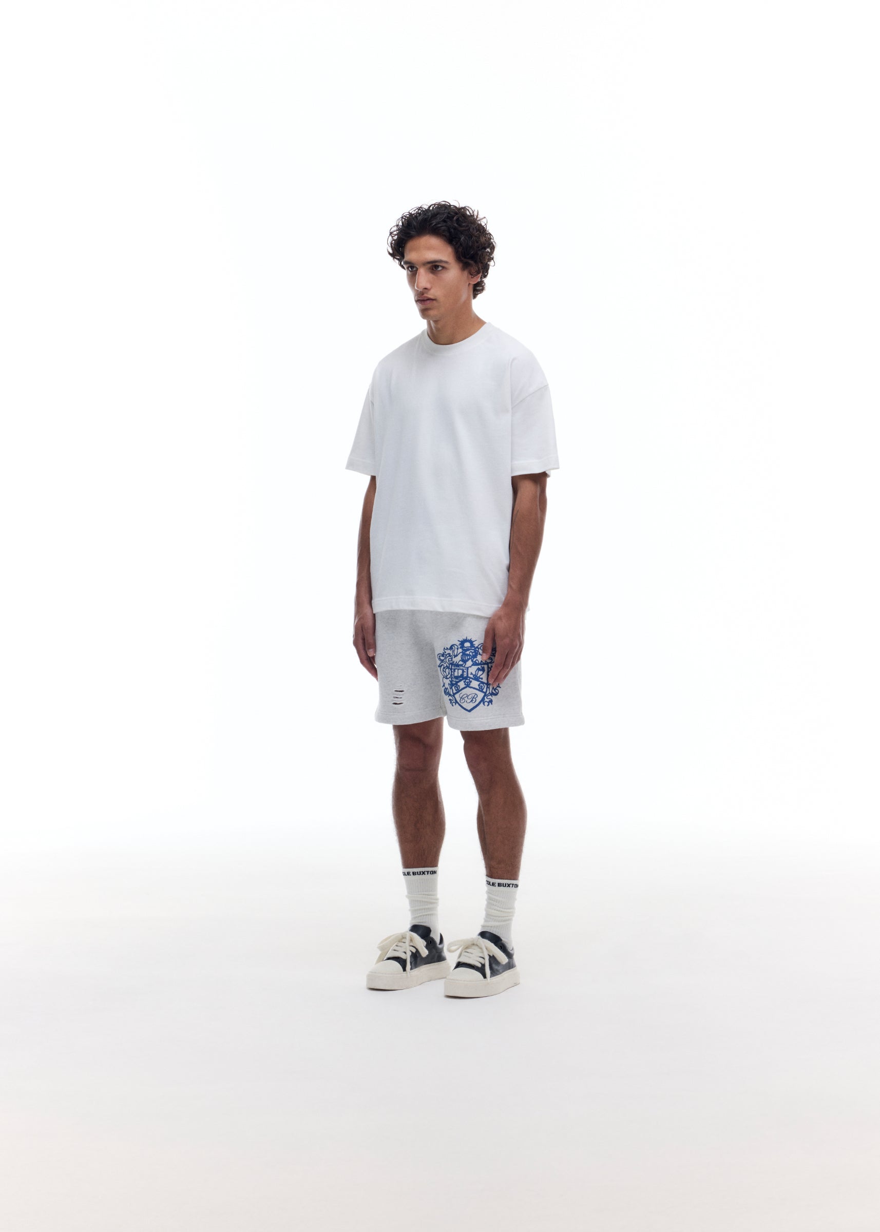DISTRESSED COLLEGIATE CREST SHORTS