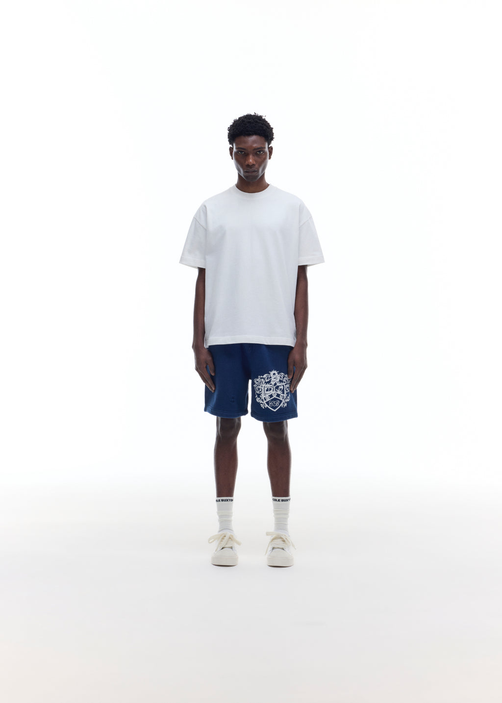 DISTRESSED COLLEGIATE CREST SHORTS