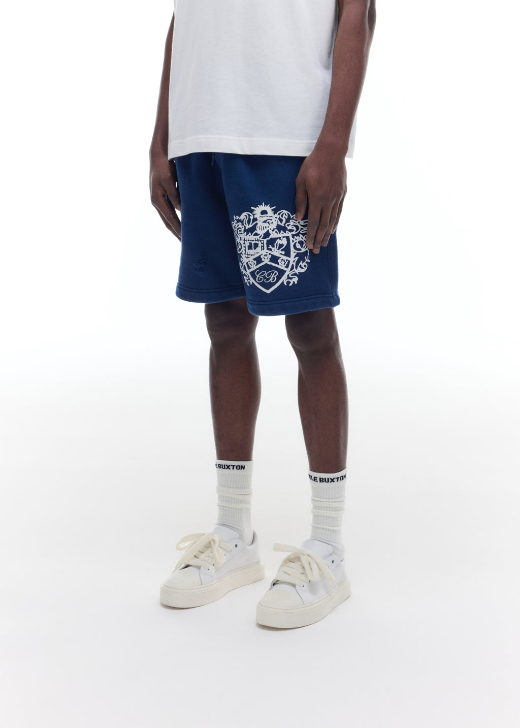 DISTRESSED COLLEGIATE CREST SHORTS